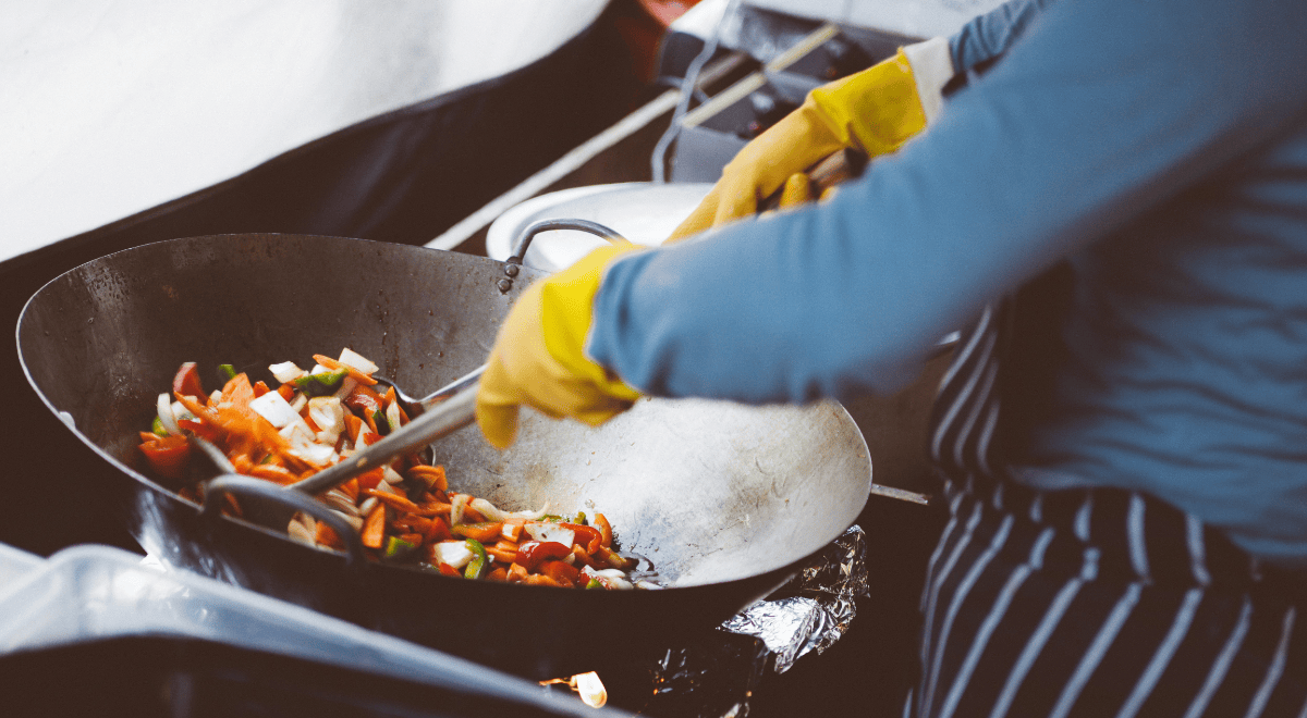 a chef cooking stir-fry