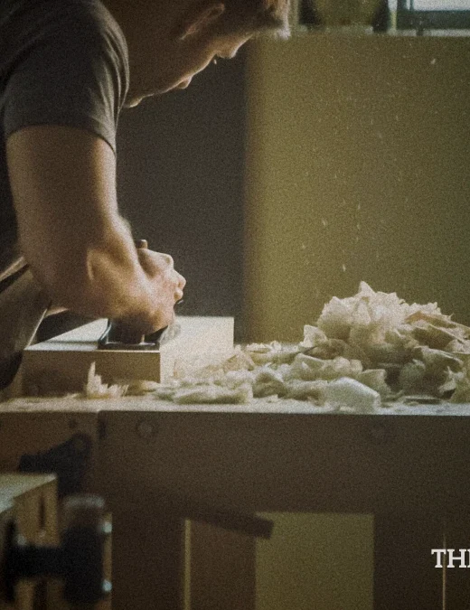 a photo of man doing custom woodworking