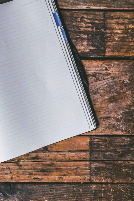 a photo of a journal on a wooden desk